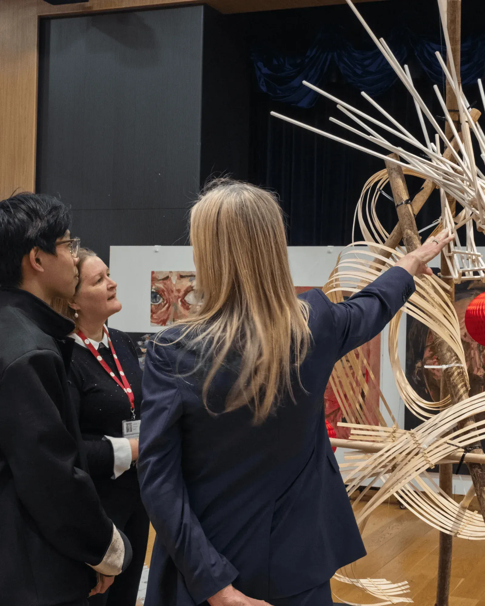 Visitors pointing up at the bamboo dragon at the opening